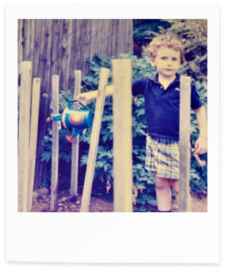 Retro polaroid photograph of a child in a garden